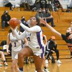 Sequims Jelissa Julmist drives past Central Kitsaps Ella Baungartner for a basket in the Wolves match-up with the Cougars on Dec. 13. Sequim Gazette photo by Michael Dashiell