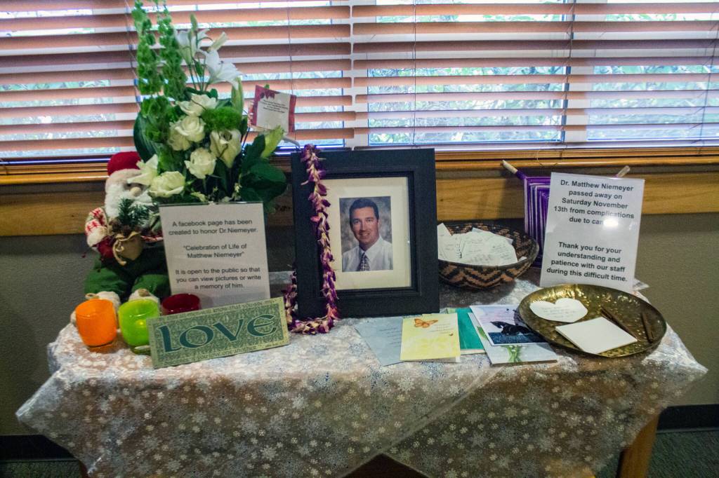 Northwest Eye Surgeons patients leave notes at a memorial table about Dr. Matthew Niemeyer. Sequim Gazette photo by Emily Matthiessen