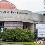 The sign outside Northwest Eye Surgeons in Sequim has become a place for mourners to place flowers in memory of Dr. Matthew Niemeyer, the peninsulas only ophthalmologist, who passed away November 13th from complications of kidney cancer, as symbolized by the ribbons. Sequim Gazette photo by Emily Matthiessen