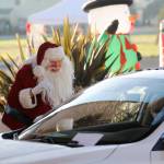 Santa Claus (Mac Macdonald) greets attendees of the Say Hello to Santa drive-by event on at Dungeness Valley Lutheran Church in December 2020. Hosted by First Teacher and the Parenting Matters Foundation, the event saw youths receiving a goodie bag while spending a socially-distanced visit with Mr. Claus and his group of group of volunteer elves. Sequim Gazette file photo by Michael Dashiell