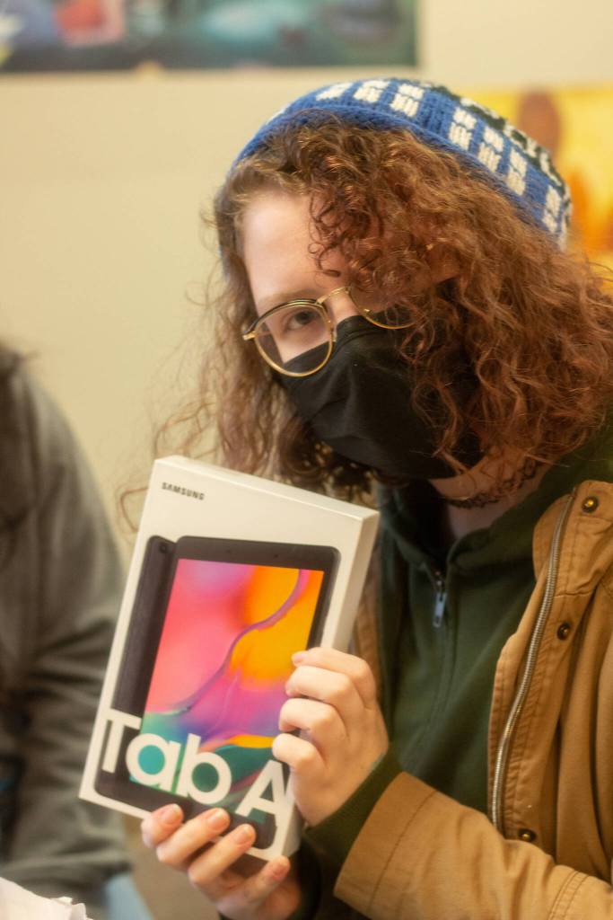 Above: Lillian Gaskill received a new tablet as part of the Winter Wishes event on Dec. 15. Photo by Charlie Logan