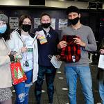 More than 400 Sequim High Schoolers received a gift of some sort last week as part of the Winter Wishes event that grants students wishes. From left, Alivia Gray, Jordan Kidd, Sammie Bacon, Sergio Arreguin, and Delaney Sisemore hold up their gifts during their home room on Dec. 15. Kidd received a gas card, and Arreguin a flannel shirt, and the other three got treats. Sequim Gazette photo by Matthew Nash