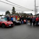 Olympic Peninsula Chapter of Club Miata Northwest members donated to the Sequim Food Bank on Dec. 16 as part of their holidays tradition. Sequim Gazette photo by Matthew Nash