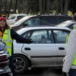 Dolores Wolfe, left, and Benni Tucker with CERT chat while directing traffic at the Family Holiday Meal Bag program on Dec. 17 in Carrie Blake Community Park. Wolfe said it was her first time volunteering with the group and her first time directing traffic. I love it, she said. Sequim Gazette photo by Matthew Nash