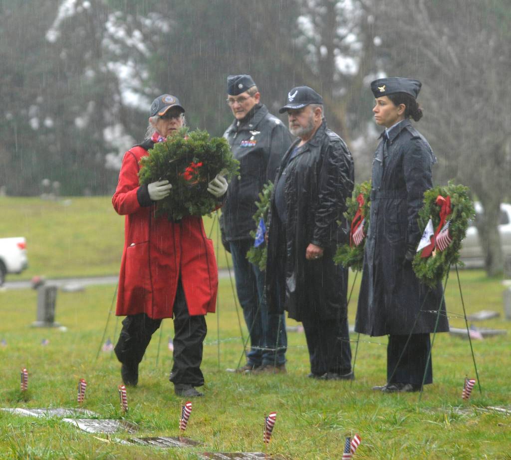 Commander Lorri Gilchrist (ret.) prepares to lay a wreath to honor those veterans who served in the U.S. Navy at Saturdays Wreaths Across America event. Sequim Gazette photos by Michael Dashiell