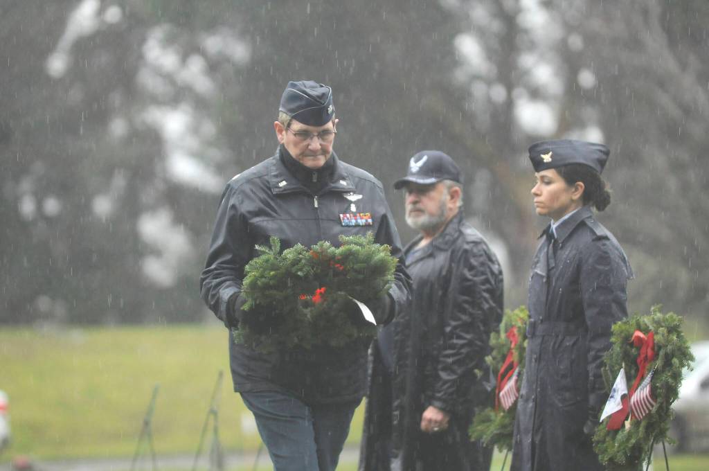 Lt. Col. Susan Sorensen (ret.) prepares to lay a ceremonial wreath honoring those who served in the U.S. Coast Guard. Sequim Gazette photo by Michael Dashiell