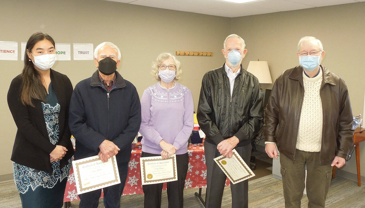 Submitted photo
JooRi Jun, executive director for Volunteer Hospice of Clallam County (far left) and board president Peter Raiswell (far right) honor outgoing board members (from left) Dave Gilbert, Nancy Bargar and Ed Hopfner.