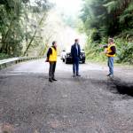 U.S. Rep. Derek Kilmer stands with workers from the state Department of Transportation who assess the damage of a landslide at Highway 112 near milepost 32. Photo by Ken Park/Olympic Peninsula News Group