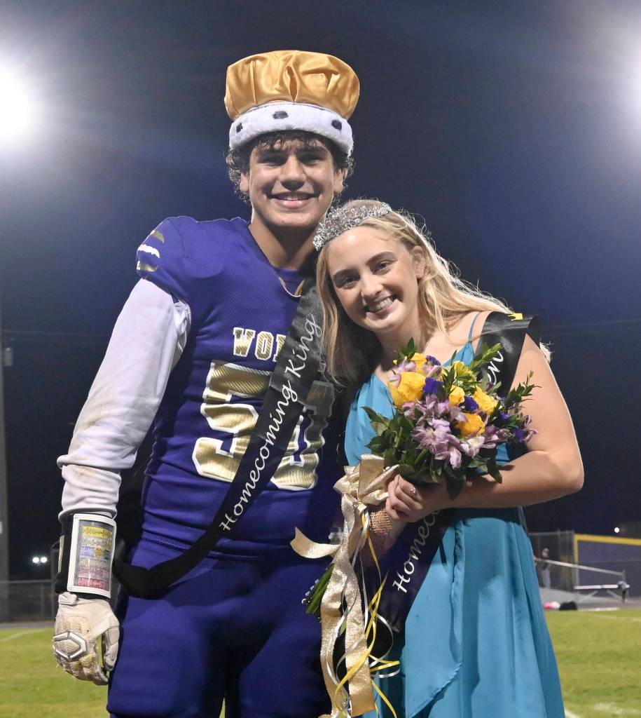 Sequim Gazette photo by Michael Dashiell
Sequim Highs Homecoming King and Queen, Pryce Glasser and Alex Schmadeke, smile for the crowd at the Homecoming game halftime festivities Oct. 16.