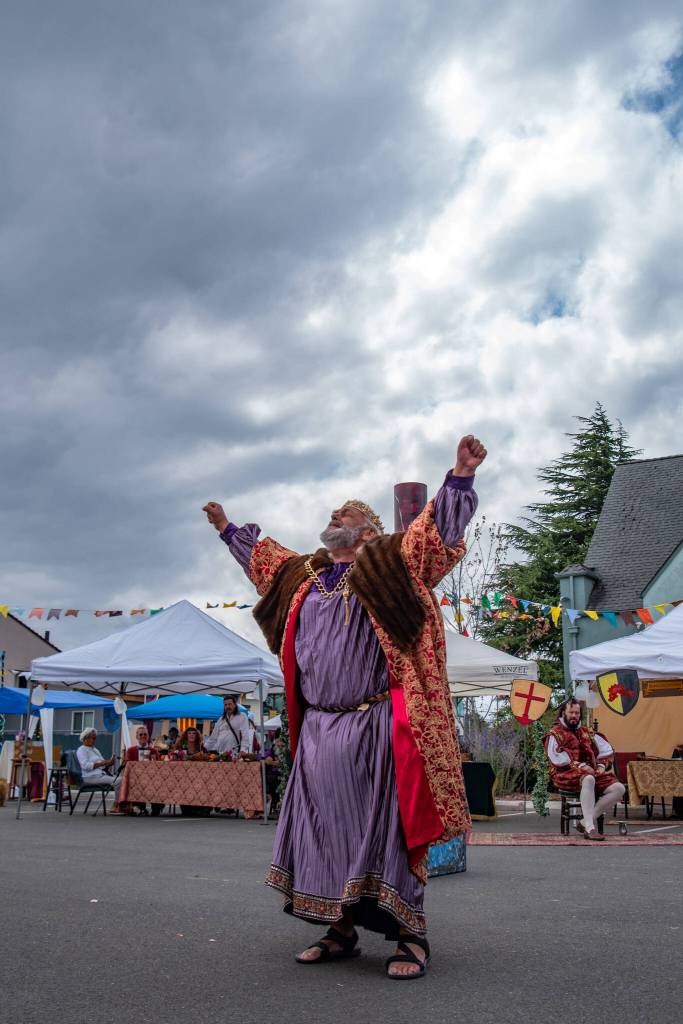 King Lear (Mark Valentine) laments to the skies as the hard hearts of his daughter begin to drive him mad in a scene from Shakespeares King Lear in the parking lot of Olympic Theatre Arts in Sequim on Aug. 22. Sequim Gazette photo by Emily Matthiessen