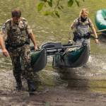 Sgt. Kit Rosenberger and officer Tierra Wessel of the Washington Department of Fish & Wildlife haul one of the new rafts recently donated to WDFW teams by the Wild Steelhead Coalition, the Wild Salmon Center and Wild Steelheaders United (Trout Unlimited). Photo by Ed Sozinho/for Wild Steelhead Coalition