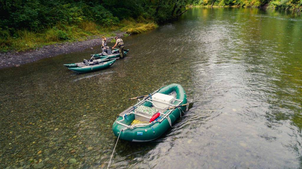 A photo taken by a newly-donated drone shows rafts provided to state wildlife law enforcement teams by three fishing advocate groups in 2021. Photo by Ed Sozinho/for Wild Steelhead Coalition
