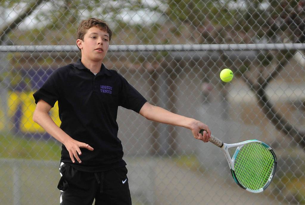 Sequims Garrett Little, pictured here as a freshman returning a shot against a North Mason foe on May 10, took Olympic League titles twice in 2021. Sequim Gazette photo by Michael Dashiell