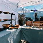 Woodenwares are on display at the Northwest Beach Works booth. Photo by Emma Jane Garcia