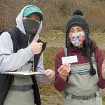 Representatives with the Makah Fisheries Management, Angelina Woods, left, and Adrianne Akmajian, hold up the first European green crab captured last year in April. The Makah Tribe would go on to catch more than 1,400 green crab, their most ever. Photo courtesy Adrianne Akmajian/ Makah Fisheries Management