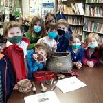 Kindergarten and first-grade students research and create tools that Native Americans used in a recent lesson at Olympic Peninsula Academy. Submitted photo
