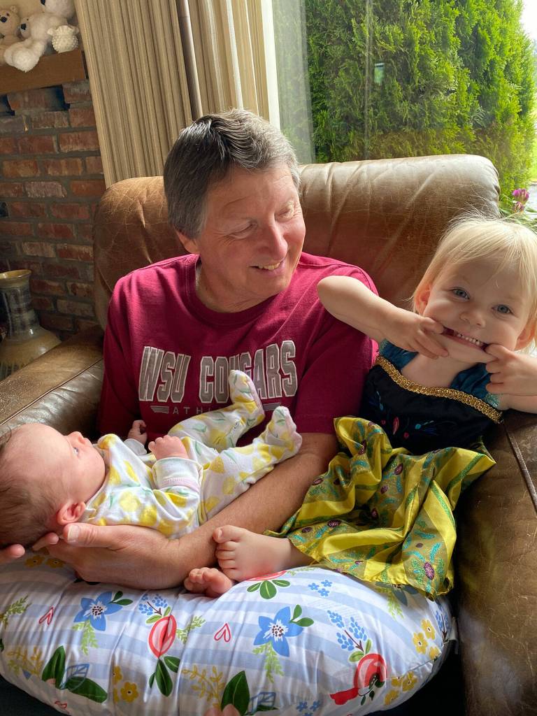 Mark Willis, pictured here with granddaughters Hudson, left, and Bryn, is recuperating from a series of strokes suffered earlier this month. Photo courtesy of the Willis/Harrington family