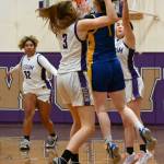 As teammate Jelissa Julmist (32) looks on, Sequims Jolene Vaara (3) and Hanna Bates forces Bremertons Brooklyn Irvine into a turnover in the second half of Sequims 71-46 win on Jan. 20. Sequim Gazette photo by Michael Dashiell