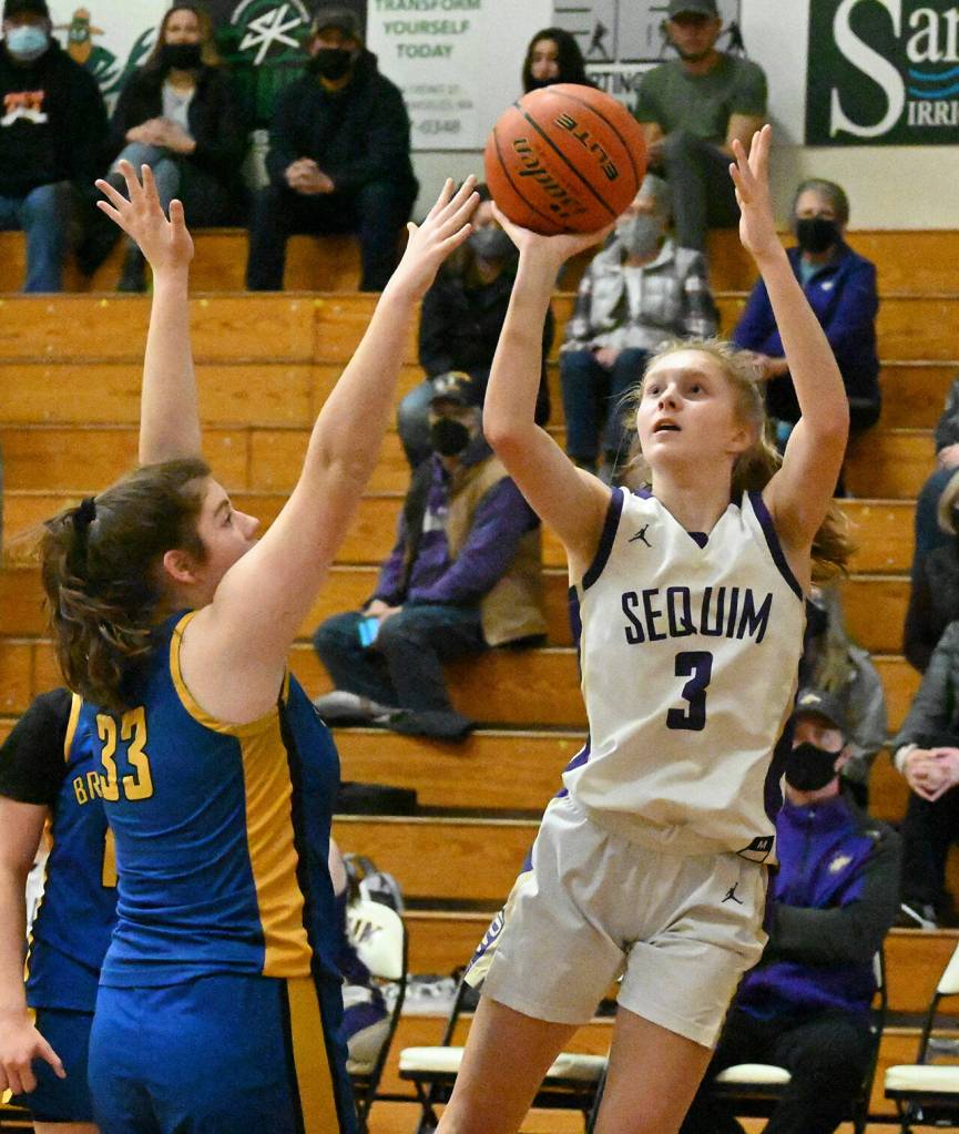 Sequims Jolene Vaara, right, puts up a jumper as Bremertons Tulip Carter tries to defend in Sequims 71-46 win on jan. 20.