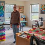 Fiber Artist Marla Varners studio in Sequim is full of light to illuminate the many color combinations she experiments with in her quilts. The Singer sewing machine in the background works.