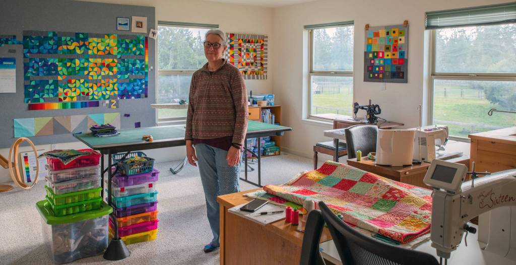 Fiber Artist Marla Varners studio in Sequim is full of light to illuminate the many color combinations she experiments with in her quilts. The Singer sewing machine in the background works.