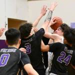 Sequim guard Jayden Possin fights through a crowd of North Kitsap defenders on the way to the basket in the first half of Sequims 78-40 Olympic League loss to the top-ranked Vikings on Jan. 20. Sequim Gazette photo by Michael Dashiell
