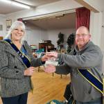 Photos by Sherrie Cerutti 
Dorinda Becker was honored for 50 years membership with the Grange by Sequim Prairie Grange President Dave McDaniels.