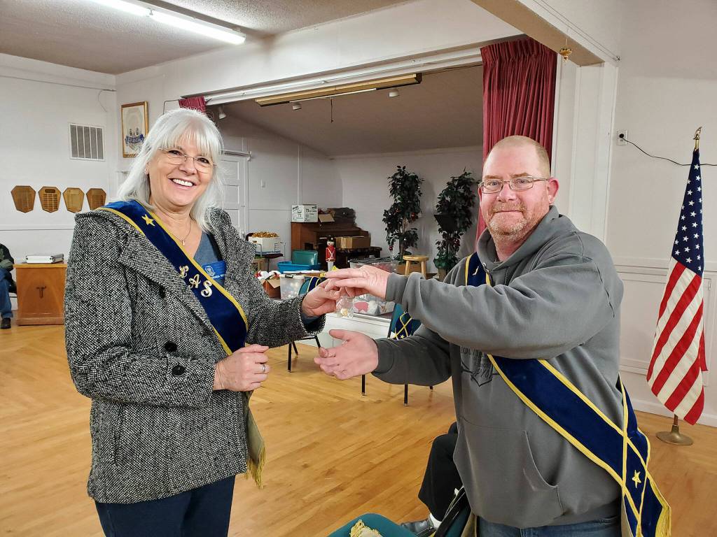 Photos by Sherrie Cerutti 
Dorinda Becker was honored for 50 years membership with the Grange by Sequim Prairie Grange President Dave McDaniels.