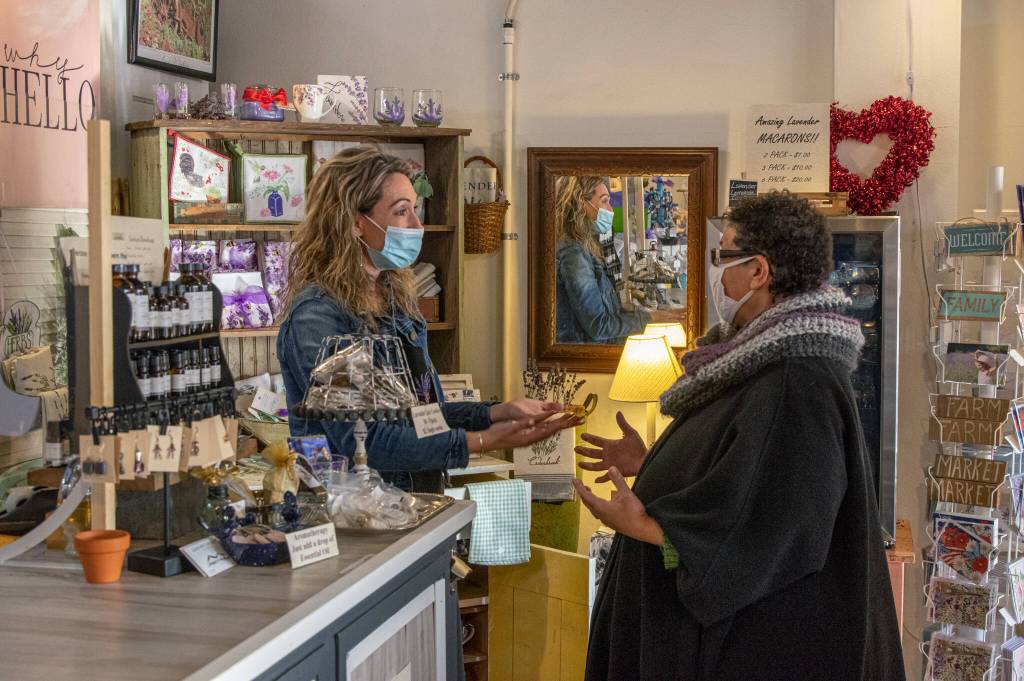 Sequim Gazette photos by Emily Matthiessen
Ashley Possin, left, talks with Christina Norman of WeDo Fudge in Cedarbrook Lavender last week. Possin and her husband Aaron bought the downtown business with plans to add more than 3,000 lavender plants to their property this spring.