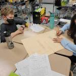 Submitted photos
Above, Zachary Gullick and Jasline Romo, fifth-graders in Saxon Holts class at Helen Haller Elementary School, draw schematics on a medieval castle. At left, Kamden Larson and Riley Glen, kindergarteners in Lorrie Corders class at Helen Haller Elementary, work on a project as they celebrate Martin Luther King Jr. Day in January.