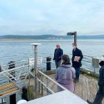 Pacific Northwest National Laboratory research scientist and dive officer John Vavrinec, at left, shares details of PNNLs work on Sequim Bay with Congressional Representatives Dan Newhouse and Derek Kilmer on Jan. 28. The congressmen plan to introduce a bill that could bring a center to promote a clean and sustainable Blue Economy in Washington and the nation. Photo courtesy PNNL