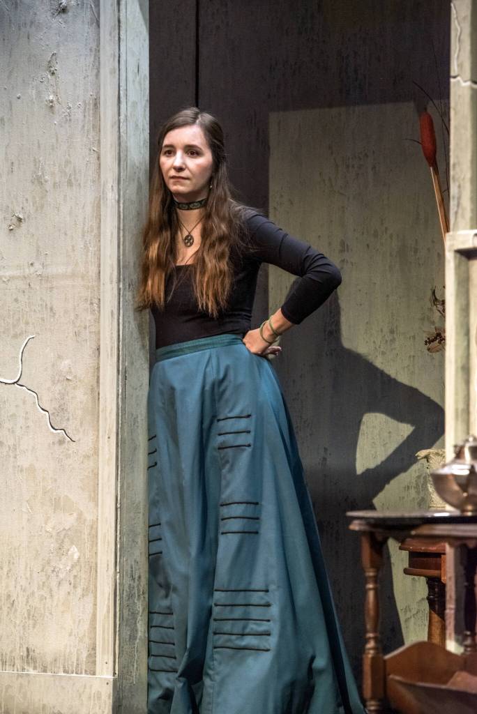 Actor Angie Roiniotis observes the scene from the set of Ginny Holladays production of Angel Street at Olympic Theatre Arts in Sequim. Sequim Gazette photo by Emily Matthiessen