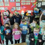 Submitted photos
Above: Students in Ione Marcys class display postcards they made for Helen Haller Elementary School counselor Jennifer Saul. Below right: Students in Rachel Odens class at Helen Haller Elementary School wear their Roman Legionary helmets.