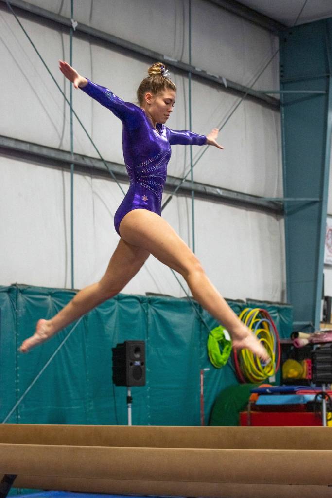 Sequim High sophomore Amara Brown competes on the beam at an Olympic League meet on Jan. 19 in Port Angeles. Sequim Gazette photo by Emily Matthiessen