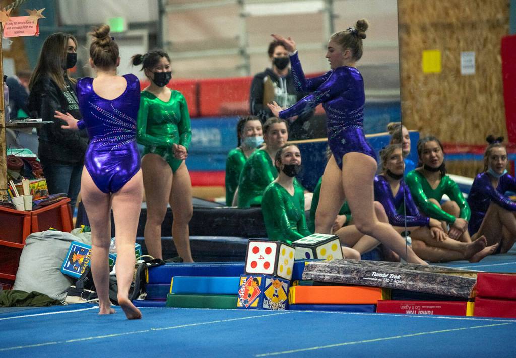Sequim High senior Alex Schmadeke competes on the floor exercise at an Olympic League meet on Jan. 19 in Port Angeles. Sequim Gazette photo by Emily Matthiessen