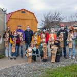 Sequim High School students, pictured here with agriculture science teacher Bill McFarlen, display purple martin nesting boxes. Fifty-two agriculture students in four classes spent three weeks making the nesting boxes in conjunction with the Department of Fish and Wildlife and Olympic Peninsula Audubon Society. The boxes are made from cedar, plywood, wire, a 6-inch PVC pipe and a 1.5-inch PVC pipe. Each of these has room for two families of purple martins and will be installed by Fish and Wildlife staff. Sequim Gazette p;hoto by Emily Matthiessen