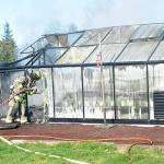 Clallam County Fire District 3 firefighters contain hot spots in a greenhouse fire on Wednesday, Feb. 16 near Heath Road. Sequim Gazette photo by Matthew Nash