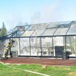 Clallam County Fire District 3 firefighters contain hot spots in a greenhouse fire on Wednesday, Feb. 16 near Heath Road. Sequim Gazette photo by Matthew Nash