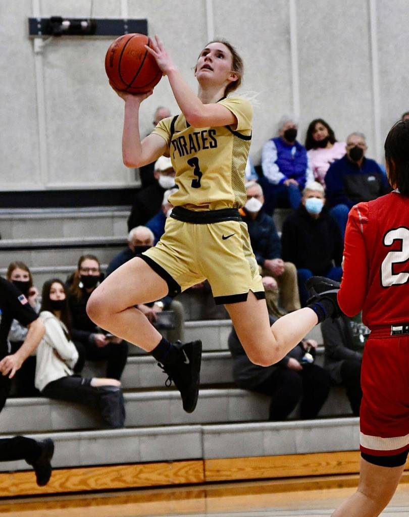 Port Angeles native Emilia Long looks for a basket in PC's 64-47 win against Skagit Valley on Feb. 17. Long had a big all-around game with 17 points, seven rebounds, six assists and five steals. Photo by Jay Cline/Peninsula College
