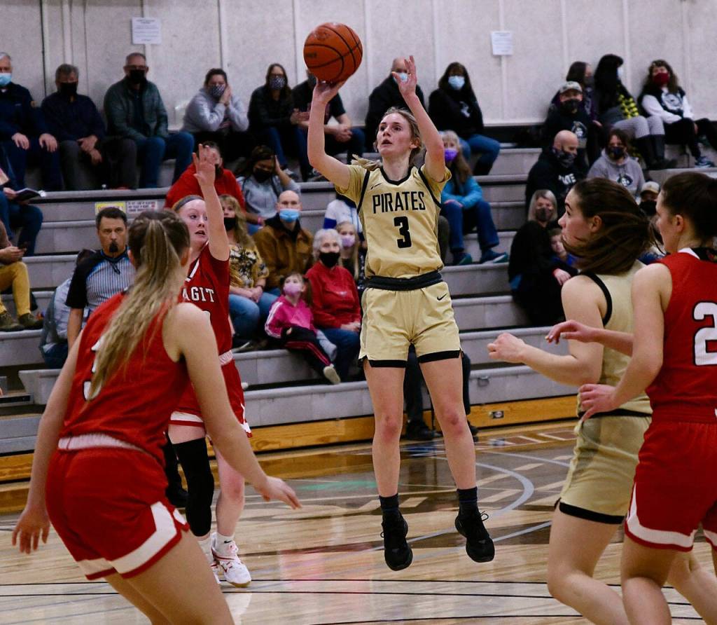 Port Angeles native Emilia Long looks for a basket in PC's 64-47 win against Skagit Valley on Feb. 17. Long had a big all-around game with 17 points, seven rebounds, six assists and five steals. Photo by Jay Cline/Peninsula College