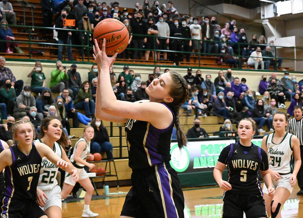 Sequims Dani Herman secures a rebound in the second half of a West Central District tourney payoff game in Port Angeles on Feb. 17. Sequim Gazette photo by Michael Dashiell