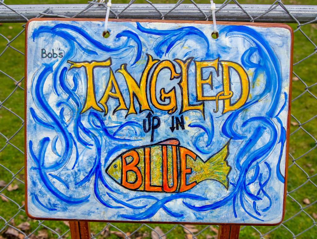 Sequim Gazette photos by Emily Matthiessen
Suzanne Horne saved an unsteady TV tray from the landfill by painting it to hang at Carrie Blake Community Park as part of the reuse/repurpose/recycle them of Art All Over - The Art Show Without Walls, sponsored by Sequim Citys Art Commission. The call for submissions will be open for months at sequimwa.gov/1008/Art-All-Over-The-Art-Show-Without-Wall.