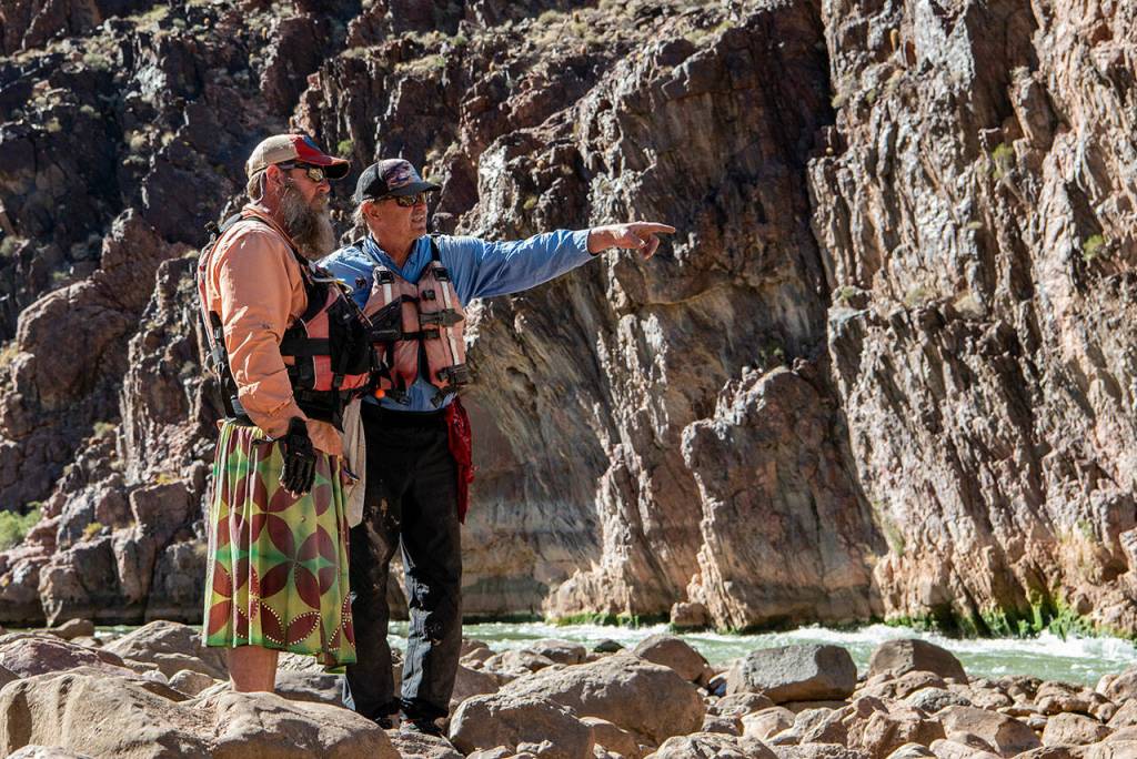 Dory oarsmen scout the Bedrock Rapid prior to running it. Photo by Dave Shreffler