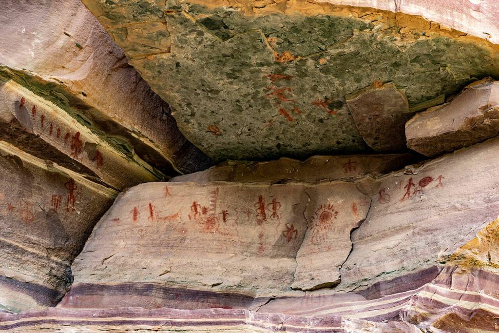 Anasazi and Paiute pictographs in a tapeats sandstone cliff near Whitmore Wash. Photo by Dave Shreffler