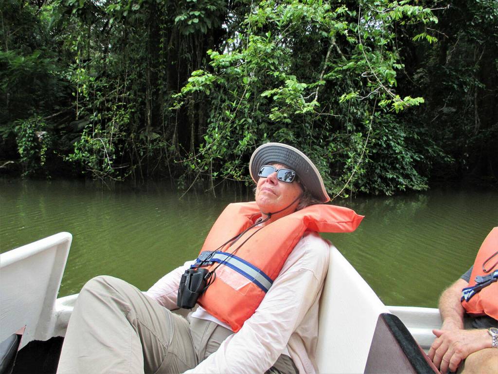 Boat riders watch for wildlife on the Tortuguero Lagoon. Photo by Mike Barton