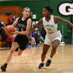 Sequim Gazette photo by Michael Dashiell 
Sequim guard Taryn Johnson, left, drives to the basket as Lyndens Kiki York guards the play in a regional state playoff game in Mount Vernon last week. Lynden prevailed, 50-26.