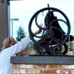 Pastor Joey Olsen blesses the 19th-century bell at Trinity United Methodist Church in February.