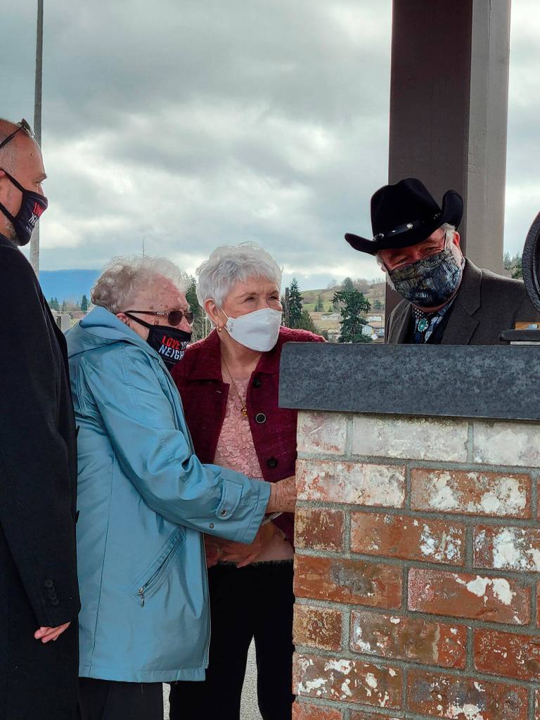 Submitted photo
Members of Trinity United Methodist Church attend a special anointing and blessing ceremony at the church on Feb. 27. Marilyn Siebens, left, and Marilyn Derau, who led the effort to reactivate the bell, prepare to give it its first ring