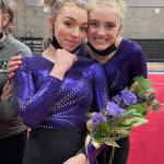 Submitted photo
Sequim High sophomore Susannah Sharp, left, and senior Alex Schmadeke take a break from the action at the Washington state 2A/3A gymnastics meet this past weekend.