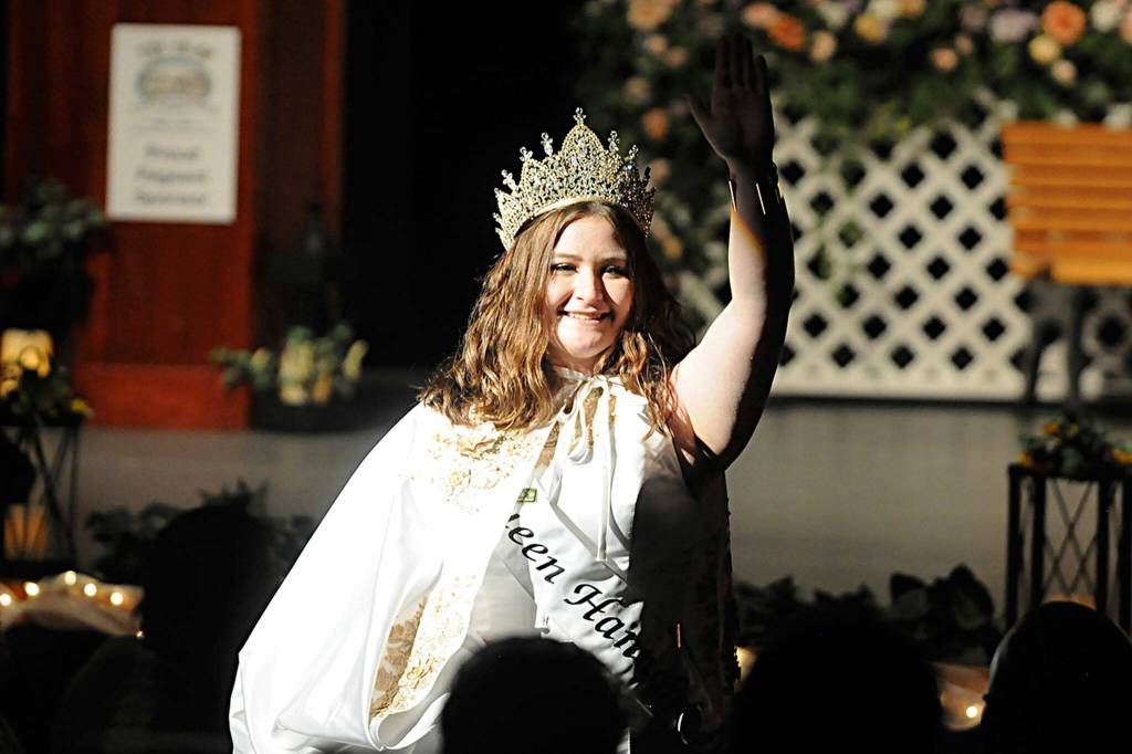 Sequim Gazette photo by Matthew Nash Last years festival queen Hannah Hampton waves goodbye during the farewell speech.